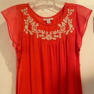 Coral top with white embroidery